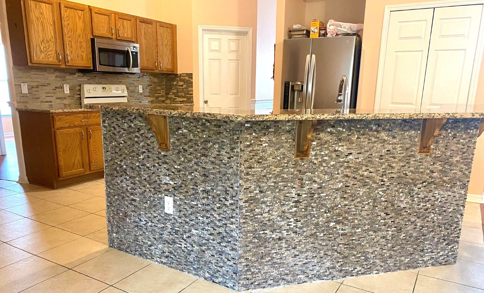 Kitchen · Stacked-stone island & granite counters