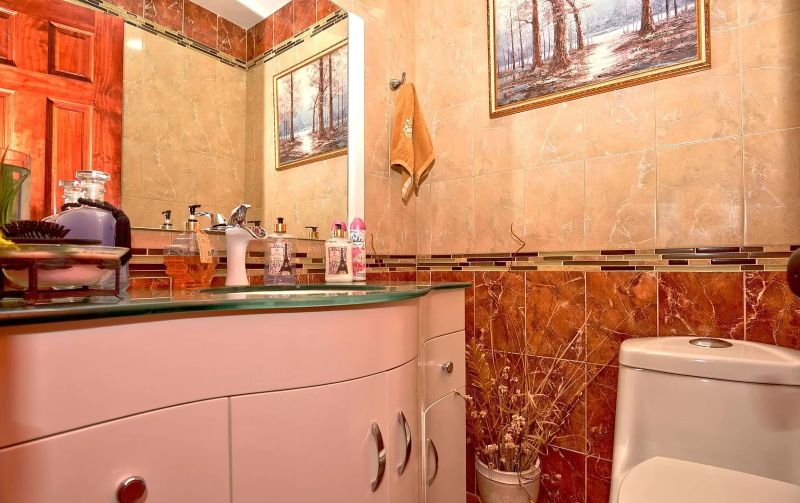 Powder room · Marble tile walls