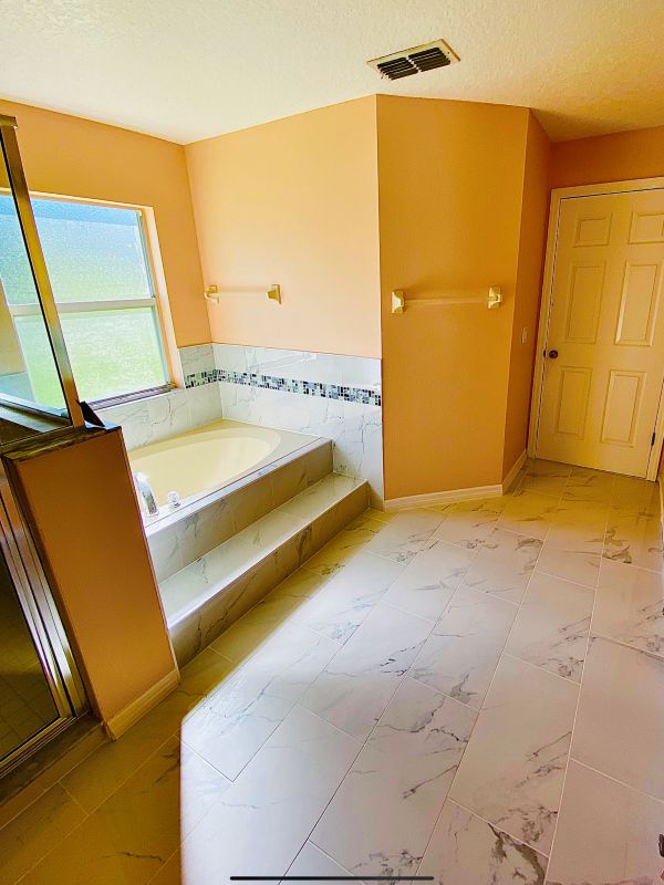 Master bathroom · Marble-look tile floor